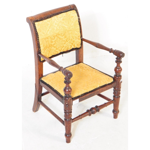 878 - A 19th century Victorian mahogany child's armchair. Having damask upholstered material with cushione... 