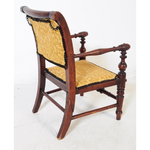 878 - A 19th century Victorian mahogany child's armchair. Having damask upholstered material with cushione... 