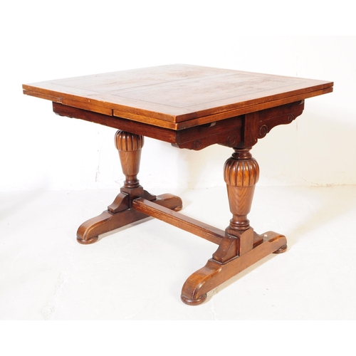 883 - A 20th century Jacobean revival oak cup and cover draw leaf dining table and six chairs. The table o... 