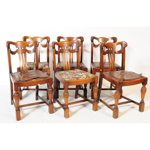 883 - A 20th century Jacobean revival oak cup and cover draw leaf dining table and six chairs. The table o... 