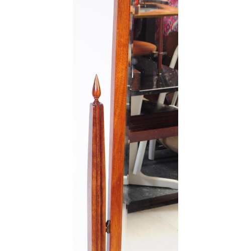 884 - A 20th century Queen Anne revival mahogany cheval mirror. The mirror suspended between two squared t... 