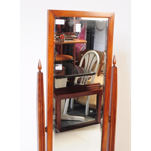 884 - A 20th century Queen Anne revival mahogany cheval mirror. The mirror suspended between two squared t... 