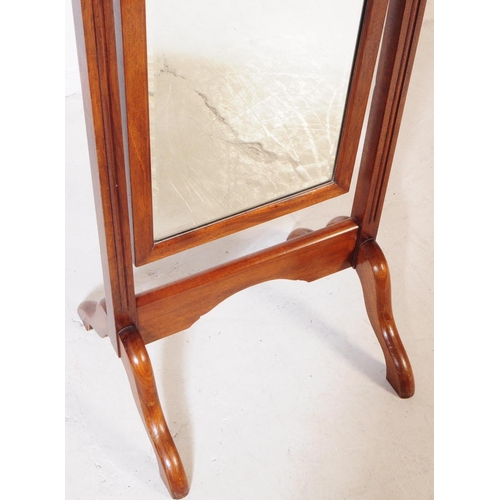 884 - A 20th century Queen Anne revival mahogany cheval mirror. The mirror suspended between two squared t... 