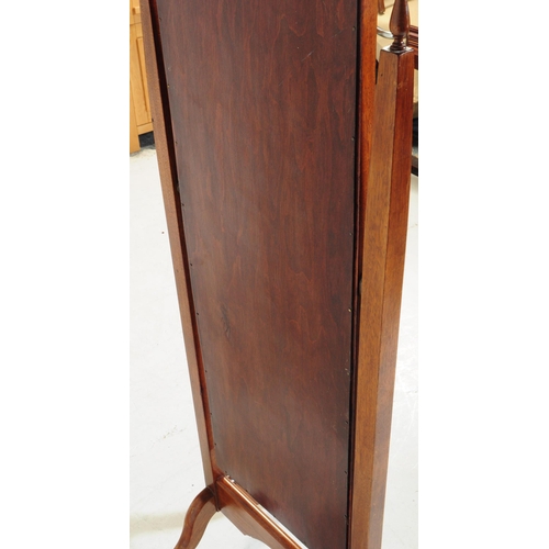 884 - A 20th century Queen Anne revival mahogany cheval mirror. The mirror suspended between two squared t... 