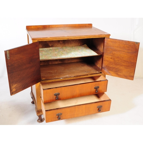 891 - An early 20th century circa. 1940s Queen Anne revival walnut veneer linen cupboard. Raised on cabrio... 