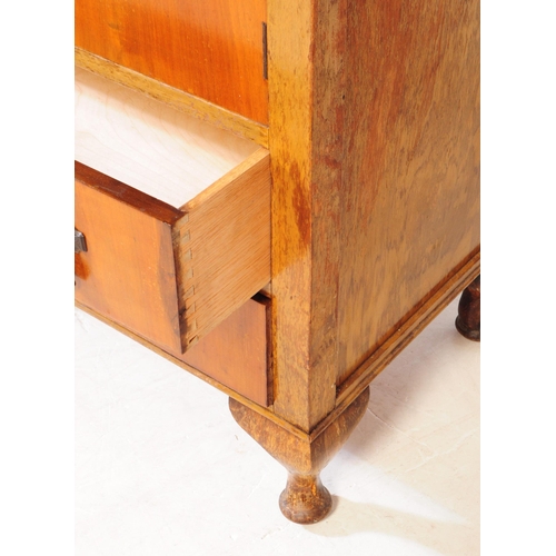 891 - An early 20th century circa. 1940s Queen Anne revival walnut veneer linen cupboard. Raised on cabrio... 