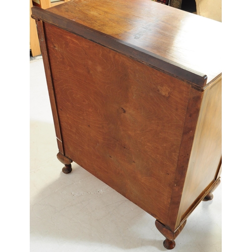 891 - An early 20th century circa. 1940s Queen Anne revival walnut veneer linen cupboard. Raised on cabrio... 