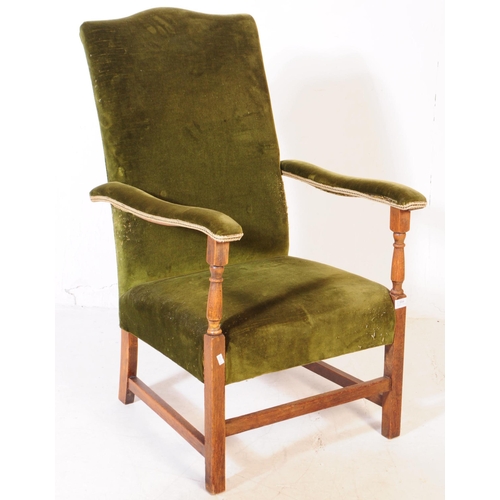 894 - Two early 20th century oak wood armchairs. The armchairs each of similar form, raised on squared sup... 