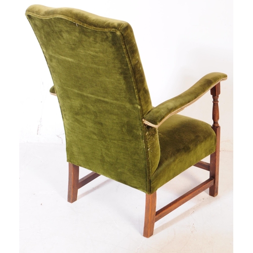 894 - Two early 20th century oak wood armchairs. The armchairs each of similar form, raised on squared sup... 