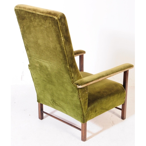 894 - Two early 20th century oak wood armchairs. The armchairs each of similar form, raised on squared sup... 