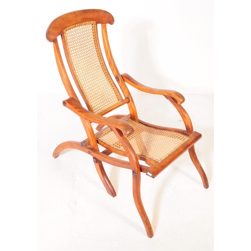 897 - A Victorian oak wood and rattan steamship cruise campaign folding deck chair. The chair featuring ra... 