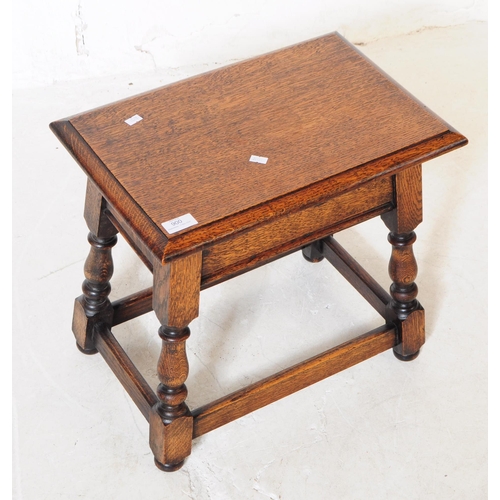 900 - An early 20th century circa 1940s oak wood joint stool / sewing box. The stool raised on block feet ... 