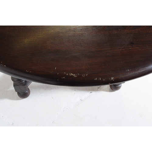 644 - Ercol - Model 705 - A 20th century Ercol Old Colonial elm wood model 705 dining table. The table rai... 