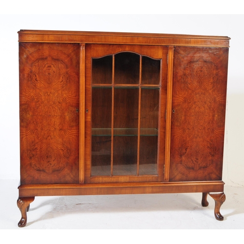 903 - A 20th century circa 1940s Queen Anne revival manner walnut veneer bookcase. The cabinet featuring t... 