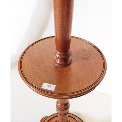 904 - An early 20th century two tier walnut plant stand jardiniere, alongside another oak example. The jar... 