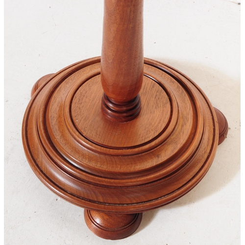 904 - An early 20th century two tier walnut plant stand jardiniere, alongside another oak example. The jar... 