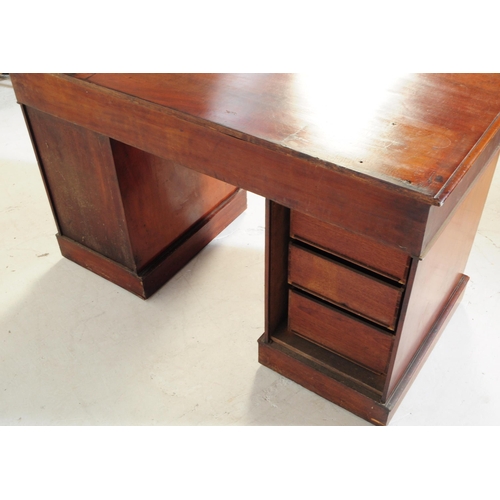 905 - A 19th century Victorian mahogany twin pedestal writing desk. The desk featuring a bank of three dra... 