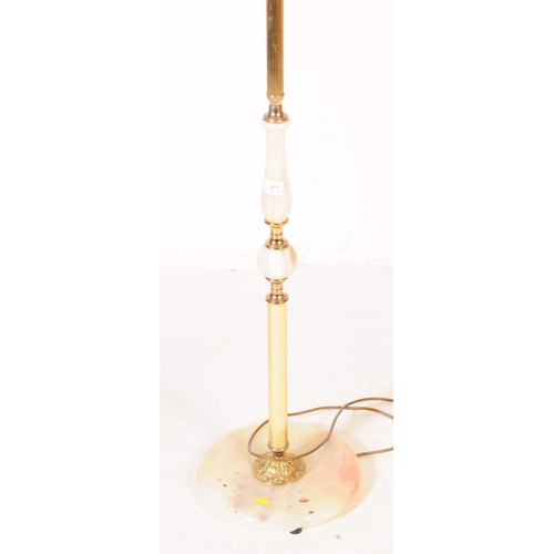 911 - A 20th century Hollywood Regency manner Onyx and Brass style floor standing lamp with shade. The lam... 