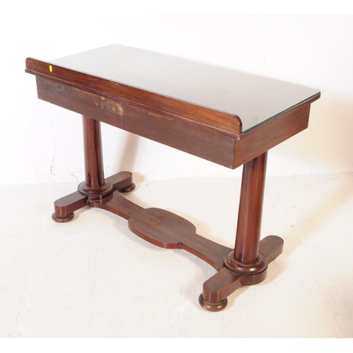 914 - A George III mahogany writing table desk. The desk raised on two thick rounded legs with bun feet, j... 