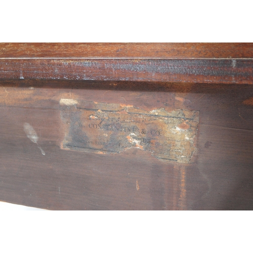 914 - A George III mahogany writing table desk. The desk raised on two thick rounded legs with bun feet, j... 