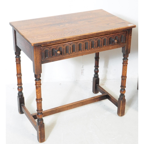 917 - Two 20th century Jacobean revival oak wood console hall tables. One table of rectangular form with t... 