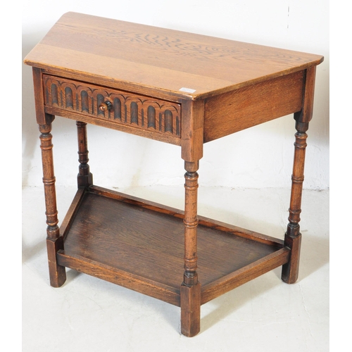 917 - Two 20th century Jacobean revival oak wood console hall tables. One table of rectangular form with t... 