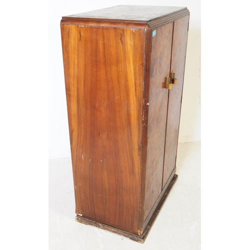 920 - A 20th century circa 1930s Art Deco walnut veneer bachelors wardrobe. Raised on a plinth base the wa... 