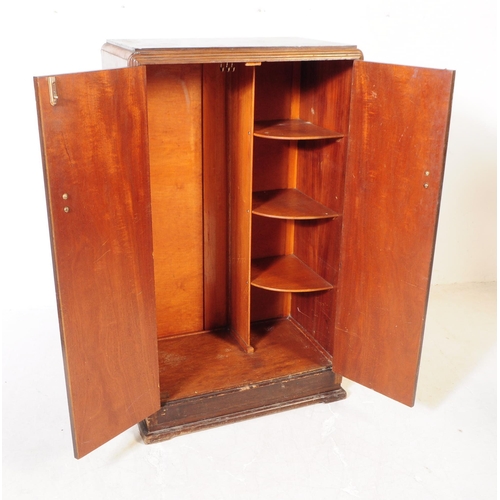 920 - A 20th century circa 1930s Art Deco walnut veneer bachelors wardrobe. Raised on a plinth base the wa... 