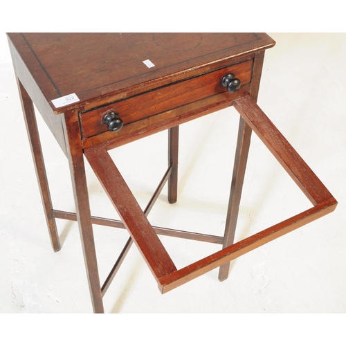 922 - A 19th century George III mahogany side table / work table. The table having an ebonised mourning in... 