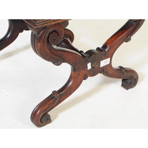 925 - A 19th century Victorian crossed leg mahogany piano stool. The stool having a needlepoint upholstere... 