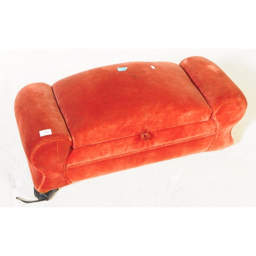 926 - An early 20th century 1930s upholstered ottoman stool. The stool having red velvet upholstery with a... 