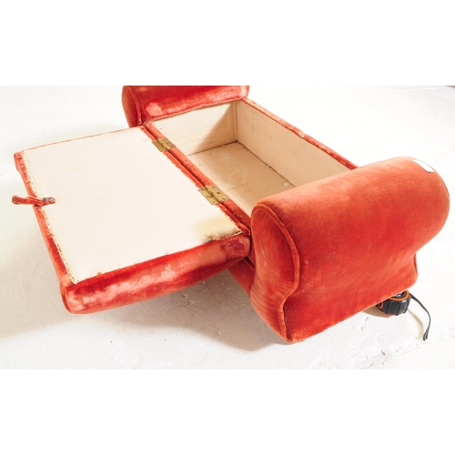 926 - An early 20th century 1930s upholstered ottoman stool. The stool having red velvet upholstery with a... 