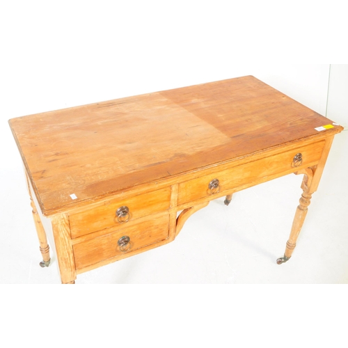 937 - A 19th century Victorian ash / oak wood writing table desk. The desk raised on turned legs terminati... 