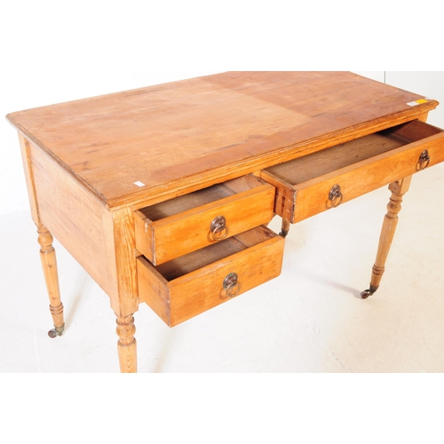 937 - A 19th century Victorian ash / oak wood writing table desk. The desk raised on turned legs terminati... 