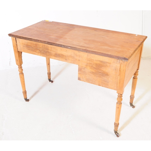 937 - A 19th century Victorian ash / oak wood writing table desk. The desk raised on turned legs terminati... 