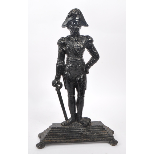 941 - An early 20th century cast iron figurative doorstop. The doorstop in the form of an 18th century Bri... 