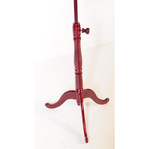 948 - A contemporary Victorian revival mahogany reading / music stand lectern. Raised on a tripod base wit... 