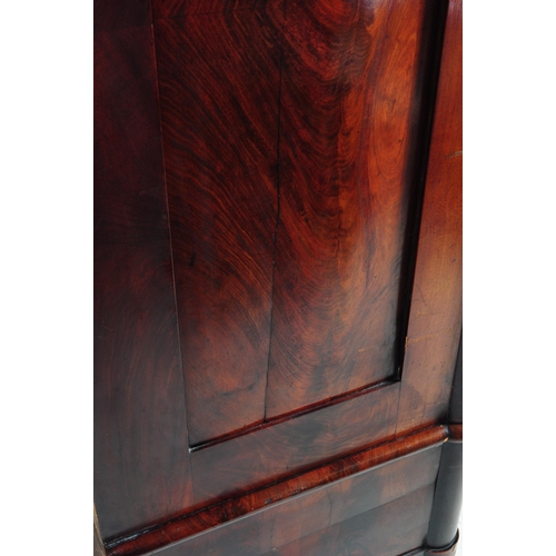 950 - An early 19th century biedermeier (continental) flame mahogany wardrobe armoire. The wardrobe featur... 