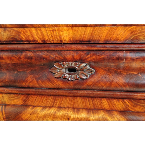 950 - An early 19th century biedermeier (continental) flame mahogany wardrobe armoire. The wardrobe featur... 