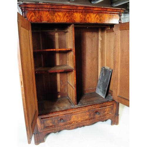 950 - An early 19th century biedermeier (continental) flame mahogany wardrobe armoire. The wardrobe featur... 