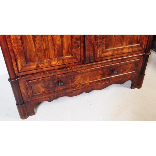 950 - An early 19th century biedermeier (continental) flame mahogany wardrobe armoire. The wardrobe featur... 