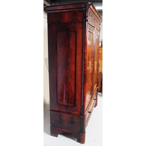 950 - An early 19th century biedermeier (continental) flame mahogany wardrobe armoire. The wardrobe featur... 