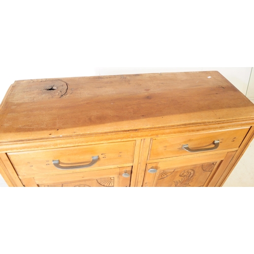 953 - An early 20th century continental ash wood sideboard. The sideboard raised on bracket feet having a ... 