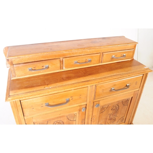 953 - An early 20th century continental ash wood sideboard. The sideboard raised on bracket feet having a ... 