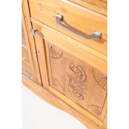 953 - An early 20th century continental ash wood sideboard. The sideboard raised on bracket feet having a ... 