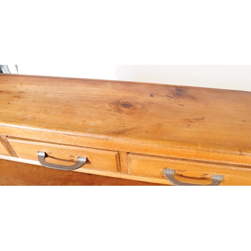 953 - An early 20th century continental ash wood sideboard. The sideboard raised on bracket feet having a ... 