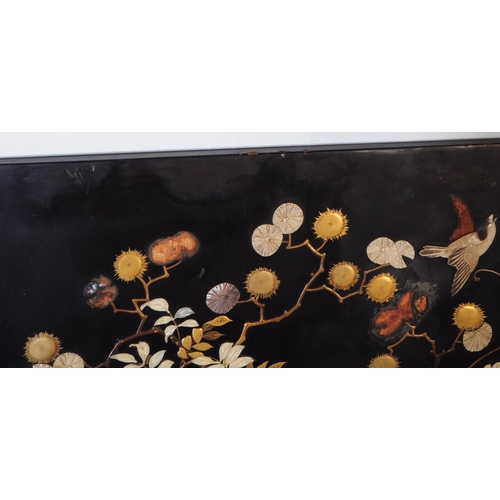 956 - An early 20th Century 1920s decorative Japanese Shibayama black lacquered wood picture panel depicti... 