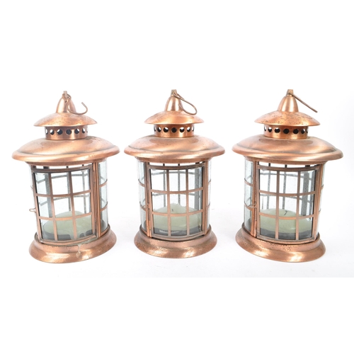 962 - A set of three large 20th Century copper and glass porch lanterns of circular form having copper squ... 