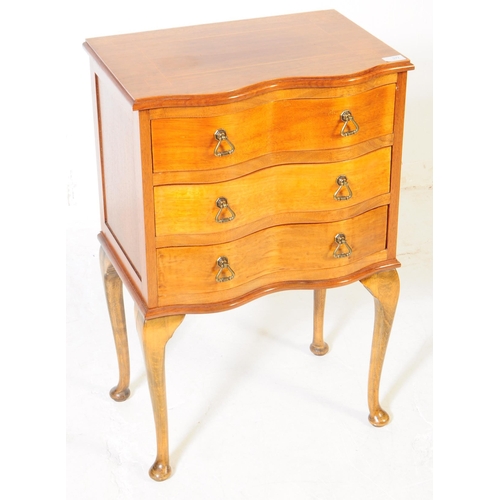 977 - A George III revival small serpentine front walnut veneer chest of drawers with three drawers. Upon ... 