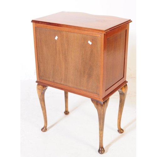 977 - A George III revival small serpentine front walnut veneer chest of drawers with three drawers. Upon ... 